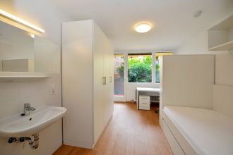 Room with balcony and new furniture (matress can be purchased at an additional cost.)